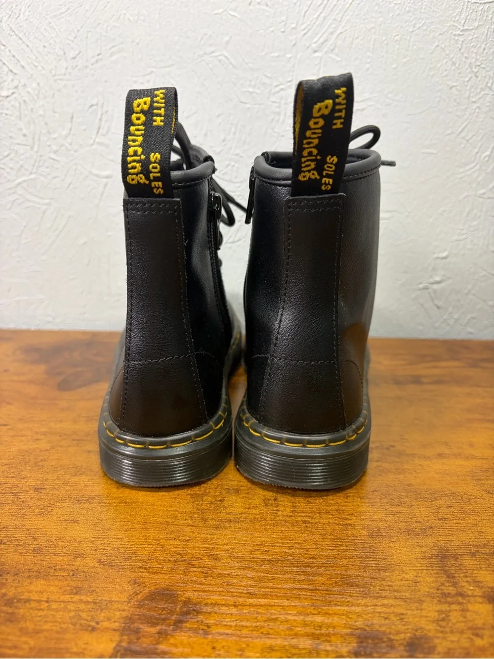 Dr. Martens Black Leather Boots with Yellow Accent